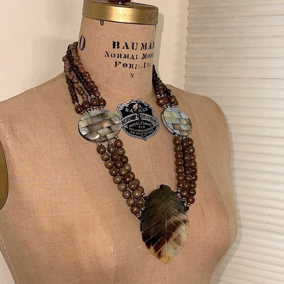 Elegant Brown Wooden Beaded Necklace with Carved Mother of Pearl Leaf Pendant - Picture 2 of 11